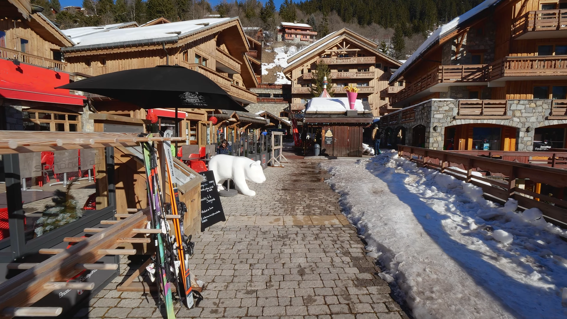 Meribel village walkway with chalets and shops