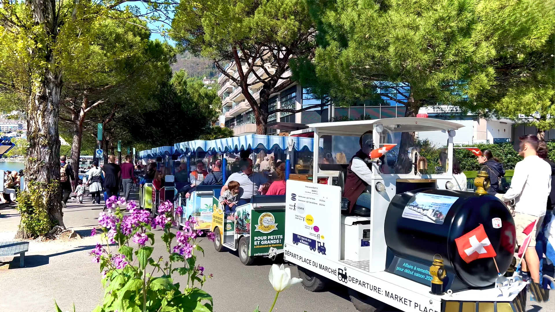 Tourist road train on the Montreux lakeside promenade